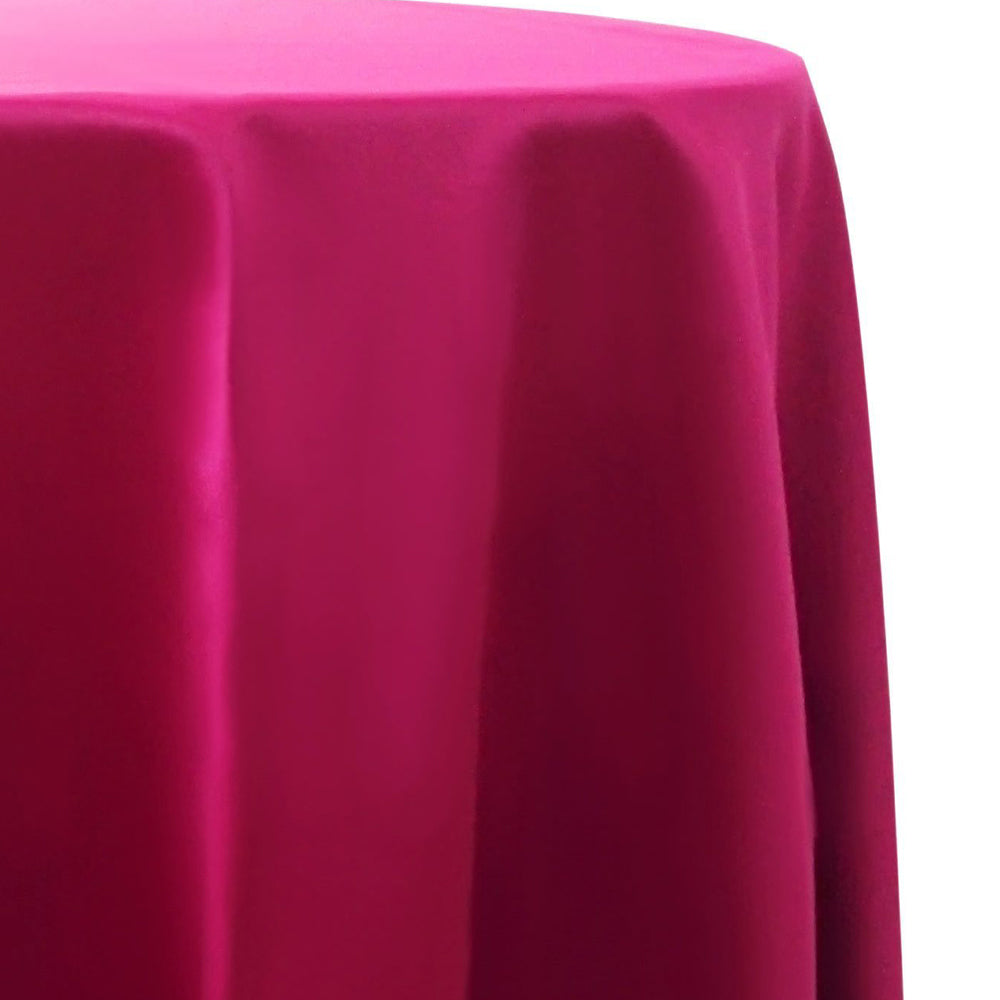 Round satin tablecloth in fuchsia, offering a bold and vibrant hue. The fuchsia satin provides a striking and elegant touch, perfect for making a statement at any event.