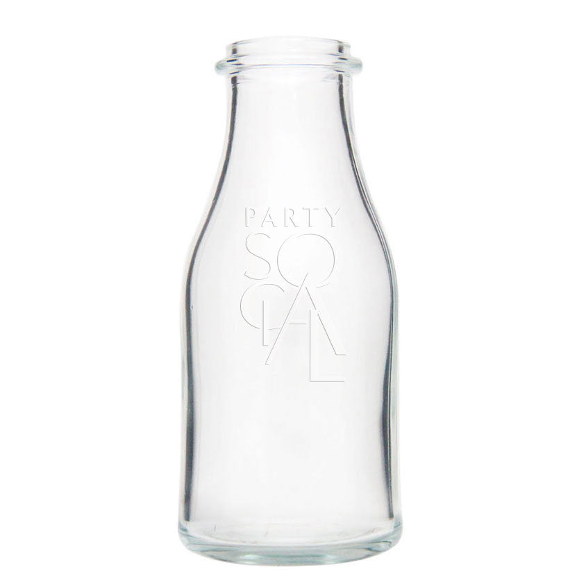 Vintage glass milk bottle with a classic rounded shape and a metal cap. The bottle features a clear, slightly frosted glass with embossed text and a nostalgic, retro design, evoking the charm of old-fashioned milk delivery.