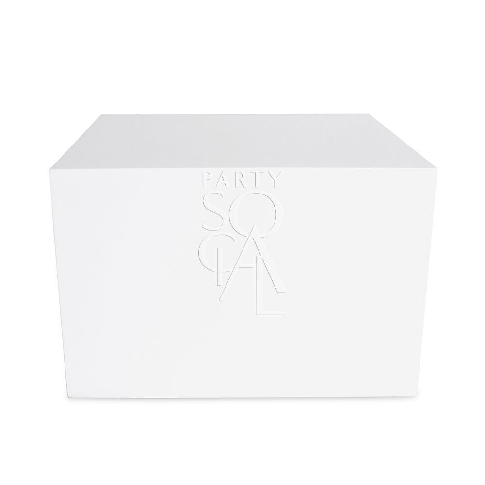 Boxy white coffee table with a clean, modern design and a minimalist rectangular shape. Features a smooth white surface and sturdy legs for a sleek, contemporary look.