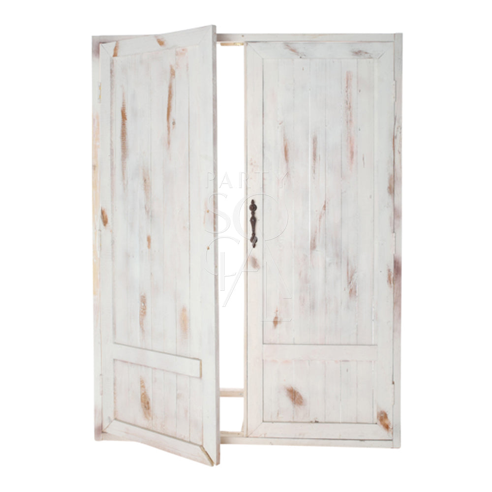 Charming whitewash vintage door backdrop featuring weathered wood with a distressed finish. The backdrop showcases rustic, antique-style doors with intricate detailing, perfect for adding a touch of shabby chic elegance and nostalgic character to photoshoots, weddings, or vintage-themed events.