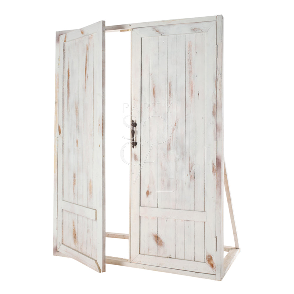 Charming whitewash vintage door backdrop featuring weathered wood with a distressed finish. The backdrop showcases rustic, antique-style doors with intricate detailing, perfect for adding a touch of shabby chic elegance and nostalgic character to photoshoots, weddings, or vintage-themed events.