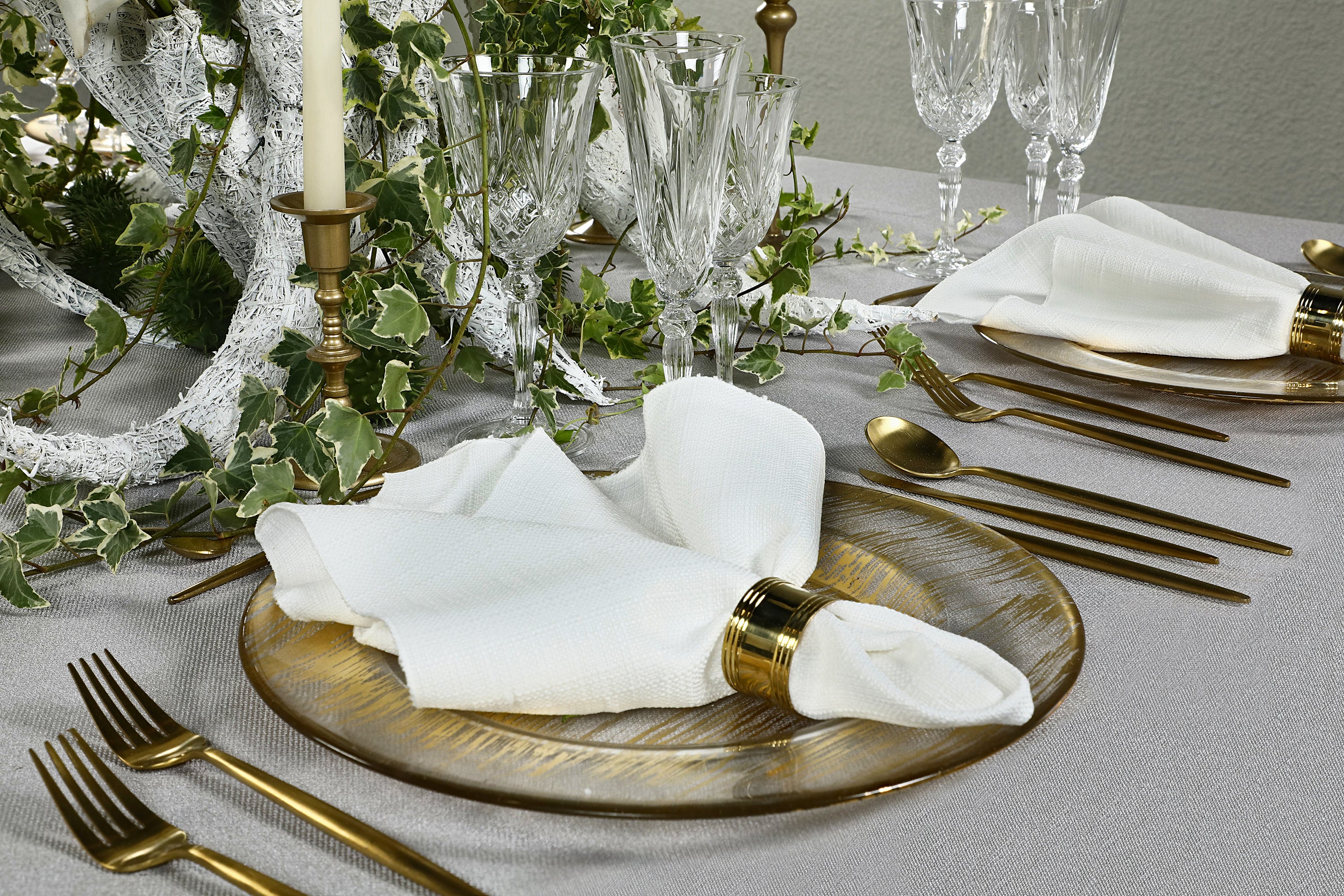 Gold brushed charger plate with a textured surface, providing a luxurious and refined appearance for a sophisticated table setting.