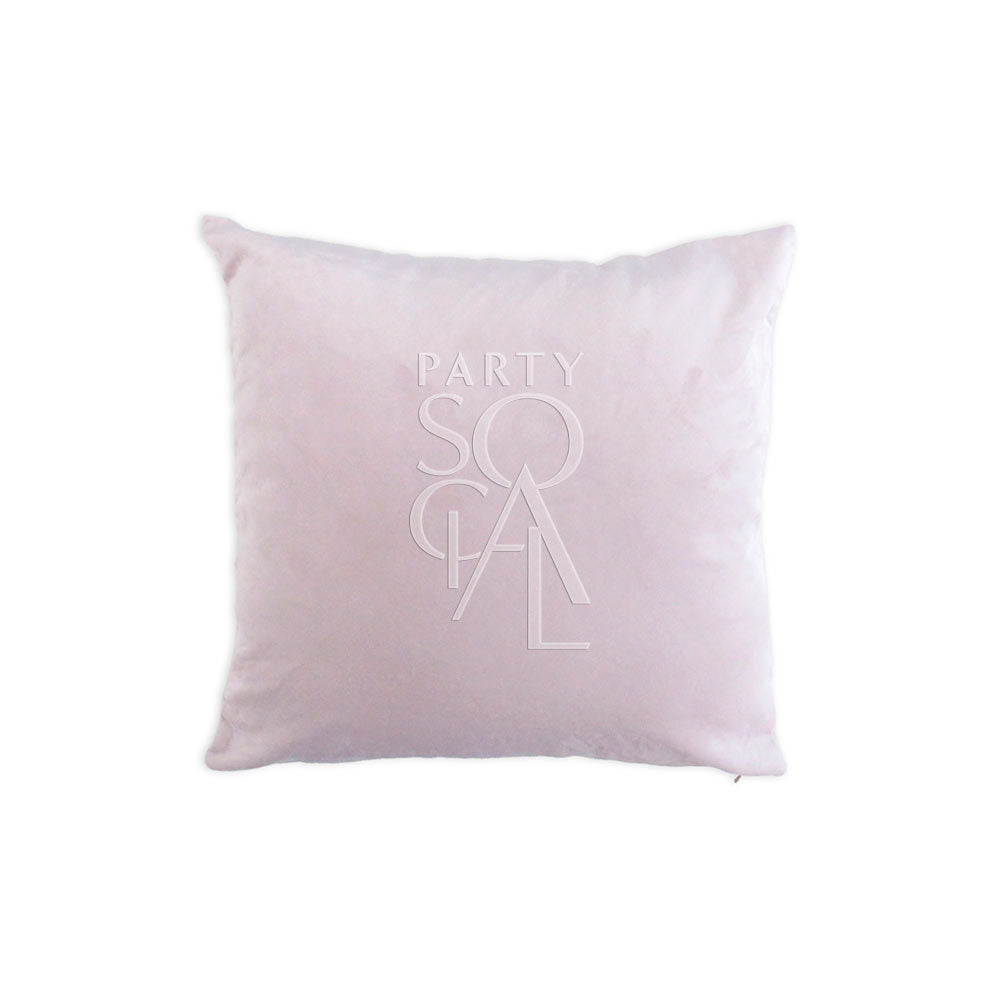 Velvet cushion cover in blush pink, adding a soft and elegant touch.