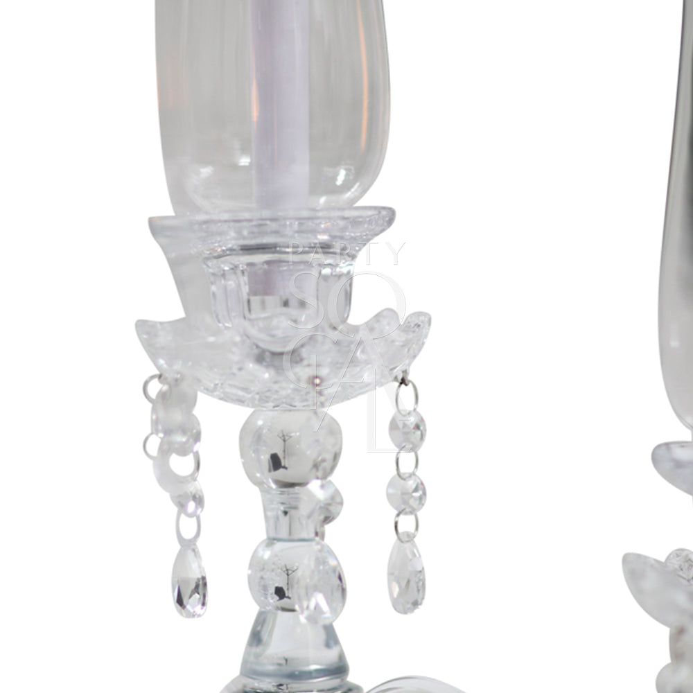 Elegant crystal glass candelabra, featuring multiple arms and intricate cut details that create a stunning sparkle. The candelabra’s clear crystal design adds a touch of sophistication and glamour, making it a perfect centerpiece for any formal or romantic setting.