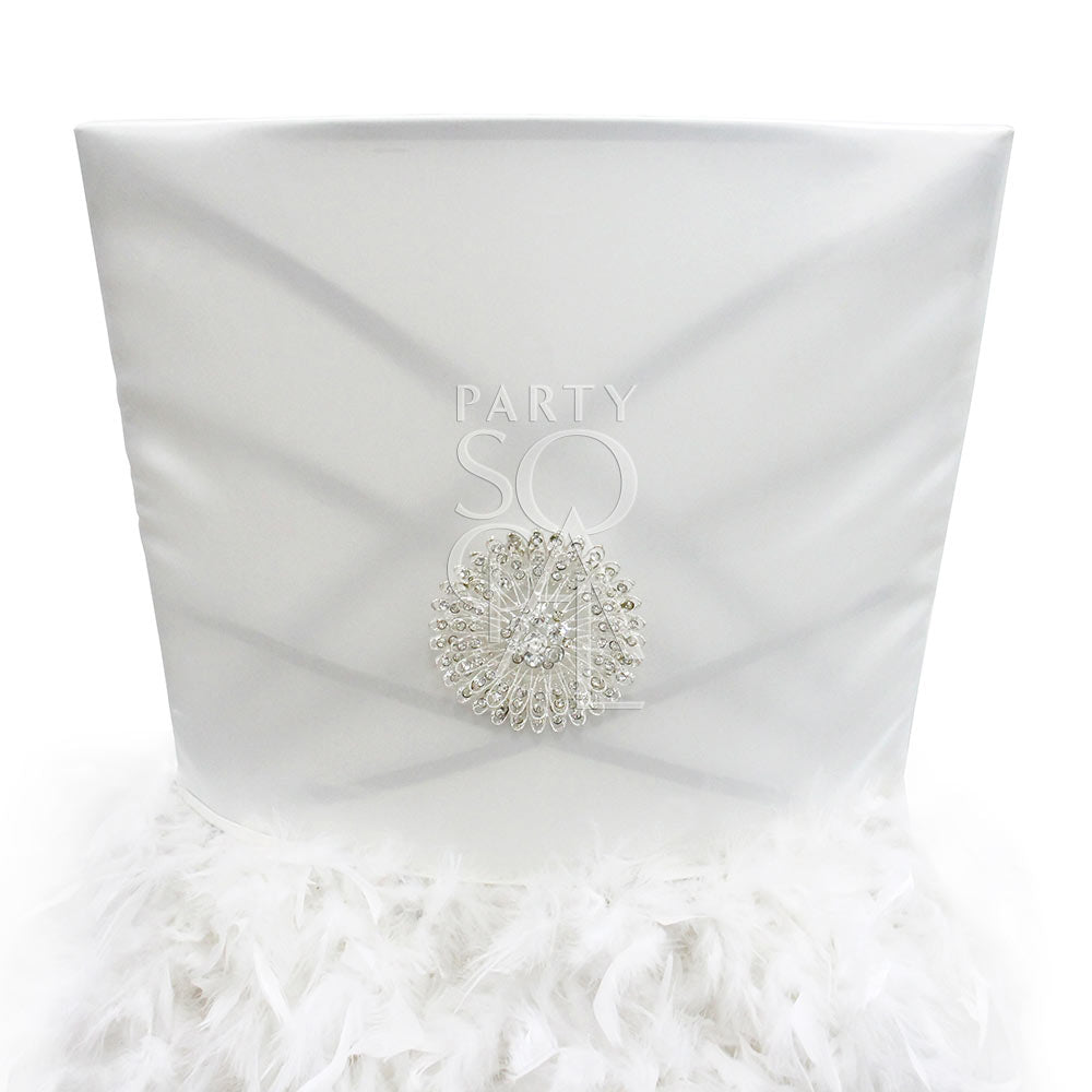 Feathered off-white satin chair cover designed for Chameleon chairs, featuring luxurious satin fabric adorned with soft, cascading feathers. This elegant cover adds a touch of glamour and sophistication to any event, with the feathers providing a unique and eye-catching texture. Perfect for weddings, galas, and high-end celebrations, this chair cover brings a sense of opulence and style to your seating arrangement.
