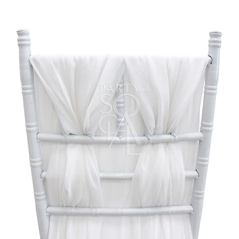 Elegant white chiffon chair cover with a flowing train designed for Chiavari chairs. Features soft, translucent chiffon fabric that adds a classic touch of sophistication.