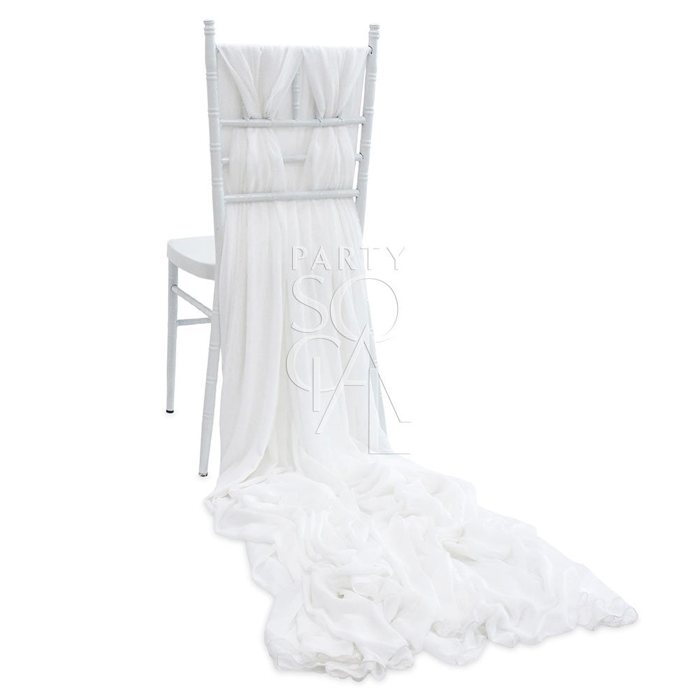 Elegant white chiffon chair cover with a flowing train designed for Chiavari chairs. Features soft, translucent chiffon fabric that adds a classic touch of sophistication.