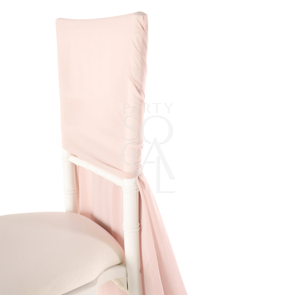 Elegant Chiavari chair cover in a soft blush pink color, featuring delicate ruffled detailing cascading down the back. The luxurious ruffles add a romantic and sophisticated touch, making it perfect for weddings, special events, or upscale gatherings, transforming any chair into a statement piece.