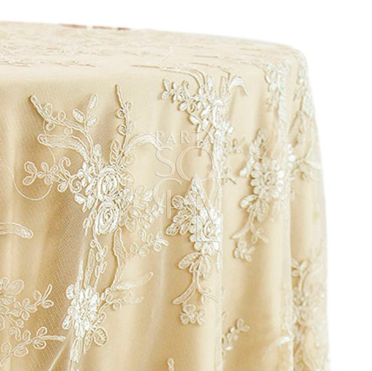 Round tablecloth with a textured fabric, featuring a subtle and elegant pattern that adds depth and interest. The textured design enhances the table setting with a sophisticated and stylish touch, ideal for both casual and formal occasions.