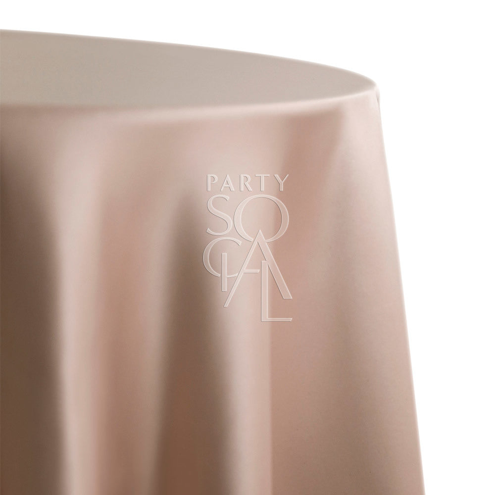 Round satin tablecloth in champagne gold, showcasing a rich and luxurious finish. The champagne gold satin adds a touch of opulence and sophistication, perfect for elevating any table setting.