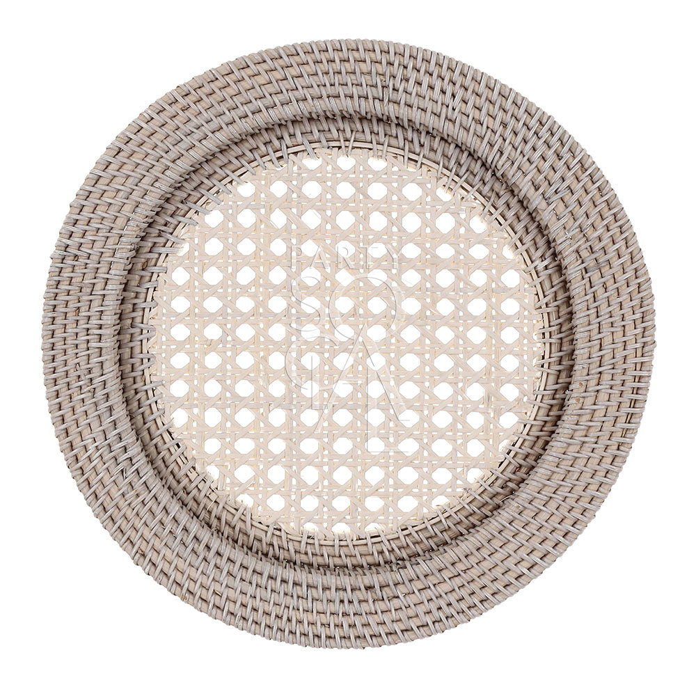 Rattan charger plate with a white wash finish, featuring a distressed and airy look. The white wash rattan adds a rustic yet elegant touch, ideal for a coastal or vintage-inspired table setting.