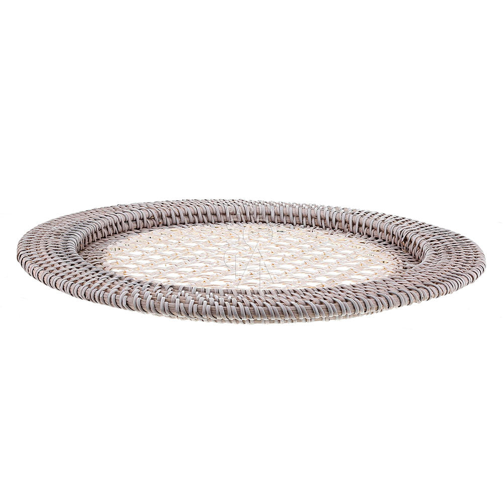Rattan charger plate with a white wash finish, featuring a distressed and airy look. The white wash rattan adds a rustic yet elegant touch, ideal for a coastal or vintage-inspired table setting.