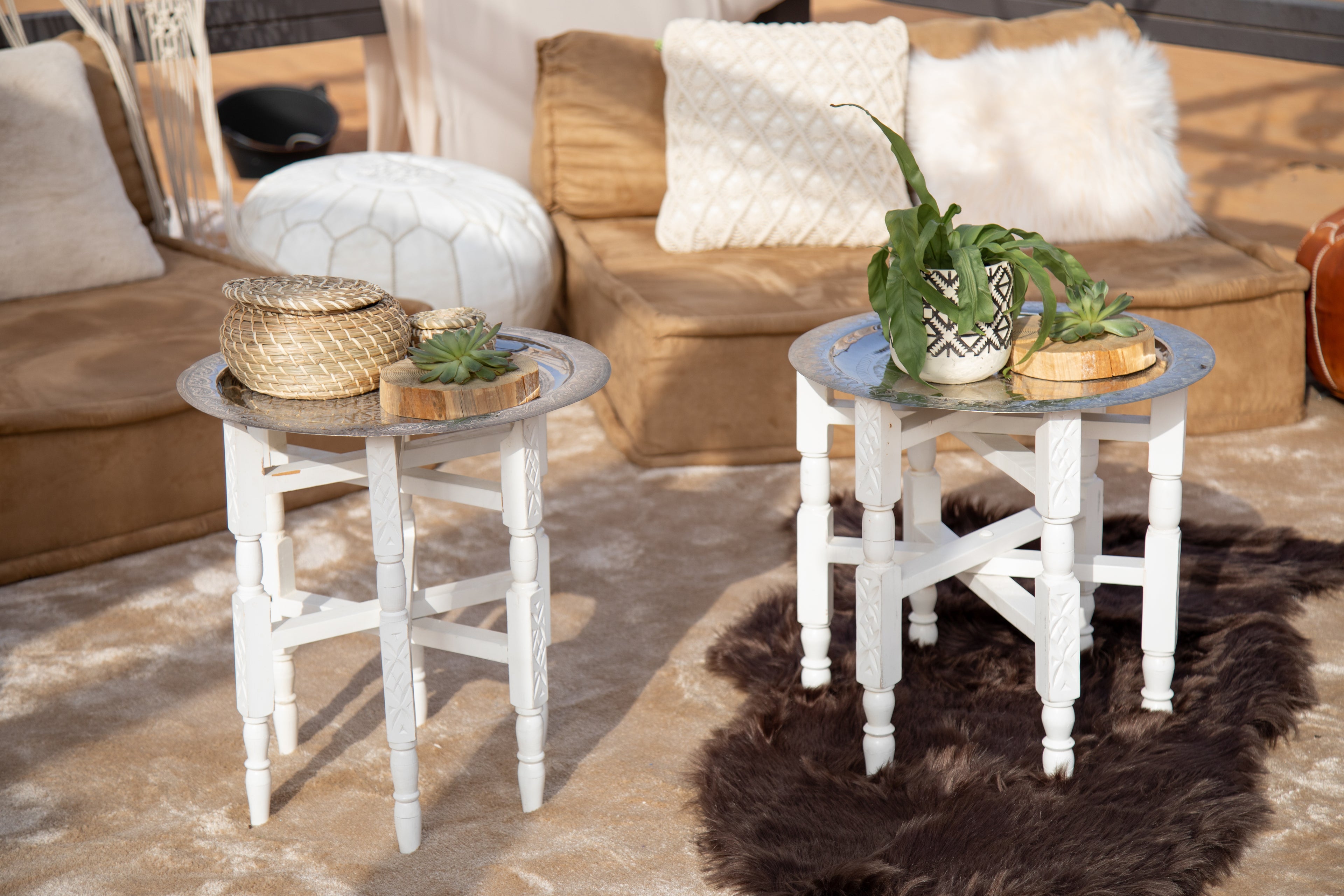 Moroccan folding table with intricate geometric patterns and vibrant colors. The table features a collapsible design for easy storage and transport, with ornate detailing typical of Moroccan craftsmanship.