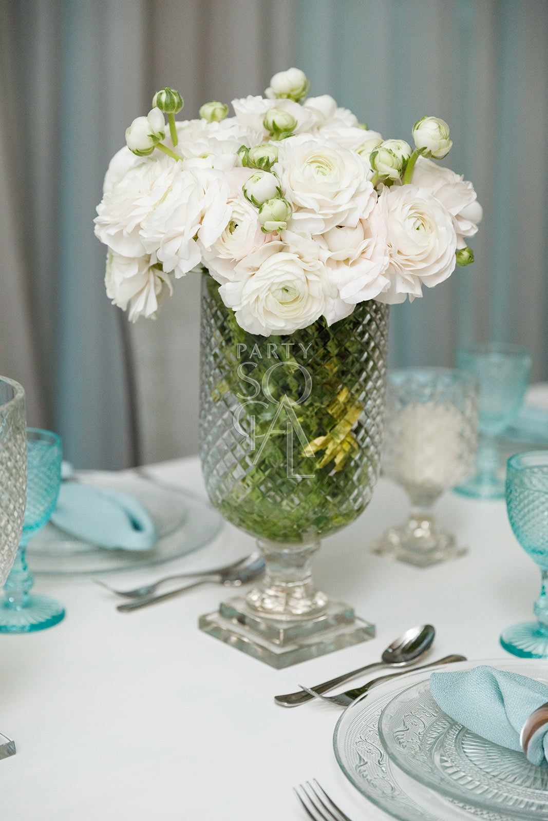 Exquisite crystal cut vases featuring intricate geometric patterns and a dazzling, faceted design. The vases’ clear, sparkling crystal enhances their elegant appearance, making them ideal for showcasing flowers or serving as decorative accents in any sophisticated setting.