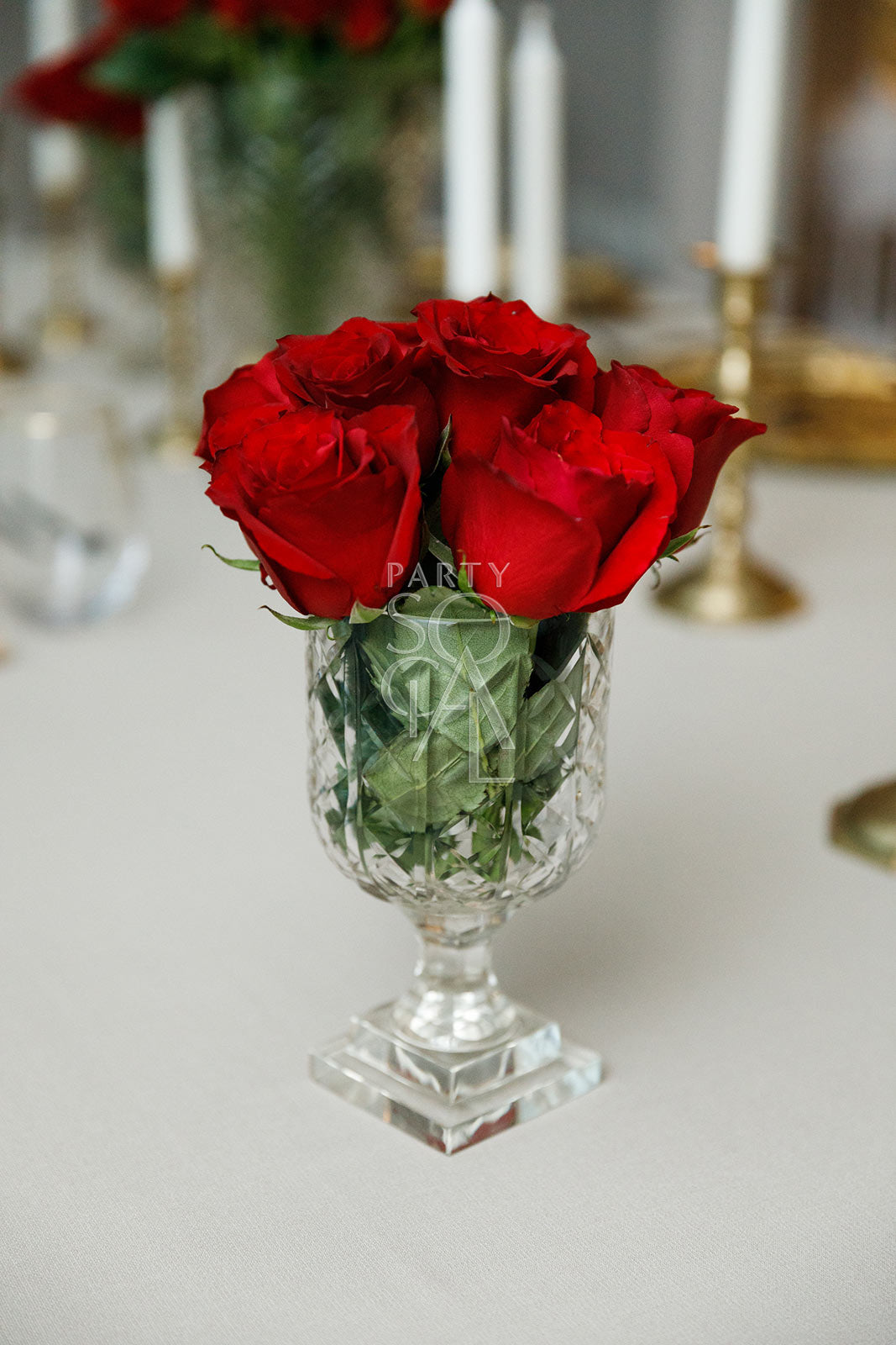 Exquisite crystal cut vases featuring intricate geometric patterns and a dazzling, faceted design. The vases’ clear, sparkling crystal enhances their elegant appearance, making them ideal for showcasing flowers or serving as decorative accents in any sophisticated setting.