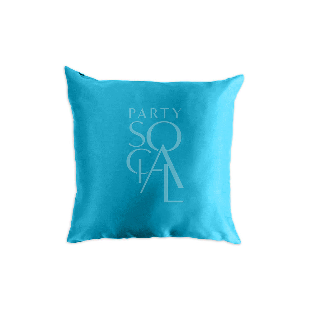 Elegant satin cushion cover in a rich teal color, showcasing a smooth and shimmering finish. The teal hue adds a stylish and sophisticated touch, ideal for adding a unique and vibrant accent to any space.