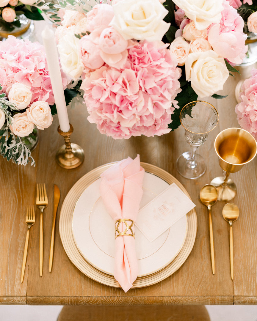 Charger plate with a classic gold-lined rim, offering a refined and elegant accent to any dining arrangement with its subtle, sophisticated detailing.