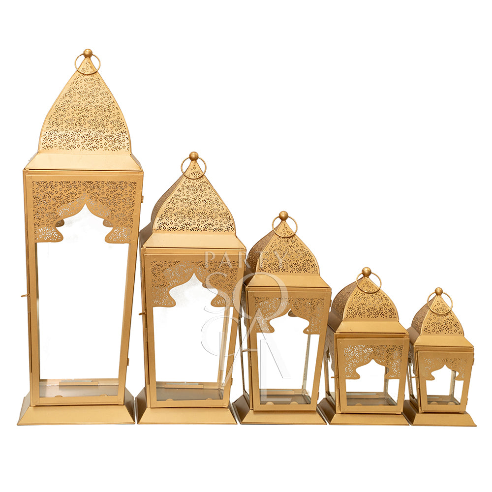 Chic rose gold lanterns with a modern metallic finish, featuring delicate cut-out patterns that cast beautiful light patterns. The lanterns add a touch of warmth and elegance, perfect for enhancing the ambiance of any space with a contemporary flair.