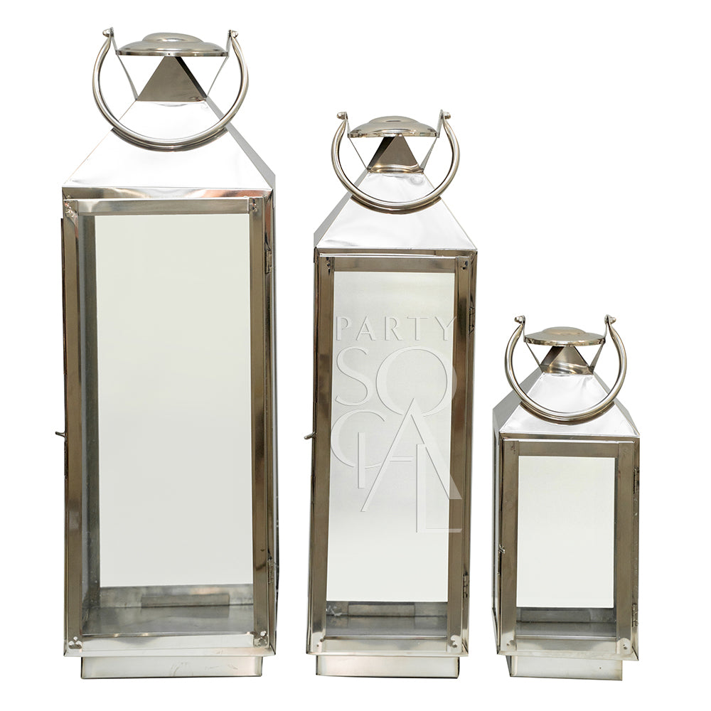 Elegant silver lanterns with a sleek, metallic finish and intricate detailing. The lanterns feature a classic design that adds a touch of sophistication and charm, perfect for illuminating and enhancing any indoor or outdoor setting.