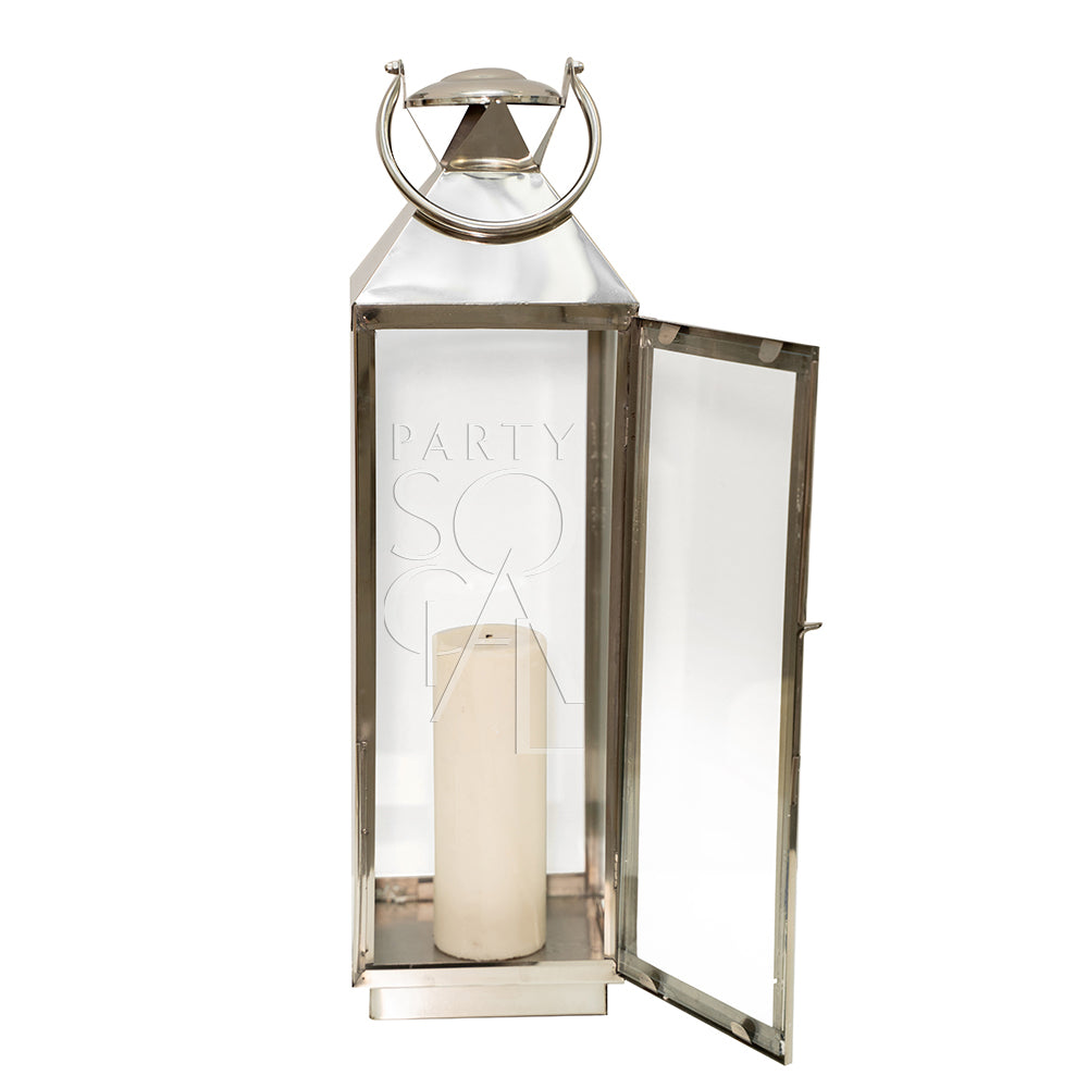Elegant silver lanterns with a sleek, metallic finish and intricate detailing. The lanterns feature a classic design that adds a touch of sophistication and charm, perfect for illuminating and enhancing any indoor or outdoor setting.