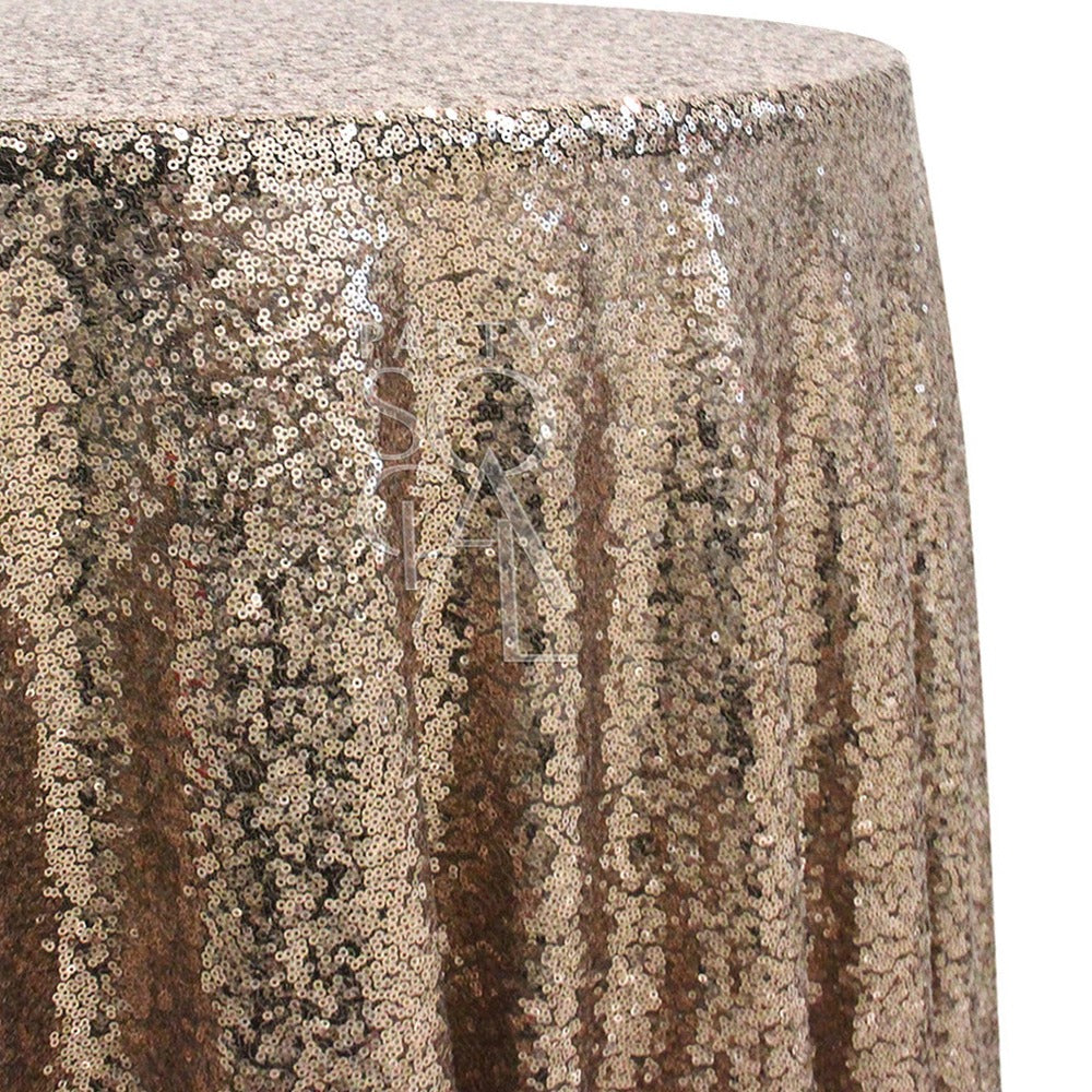 Round sequin tablecloth in dark champagne, with a rich, warm tone and shimmering sequins. The dark champagne color provides a sophisticated and luxurious feel, ideal for creating an opulent atmosphere.