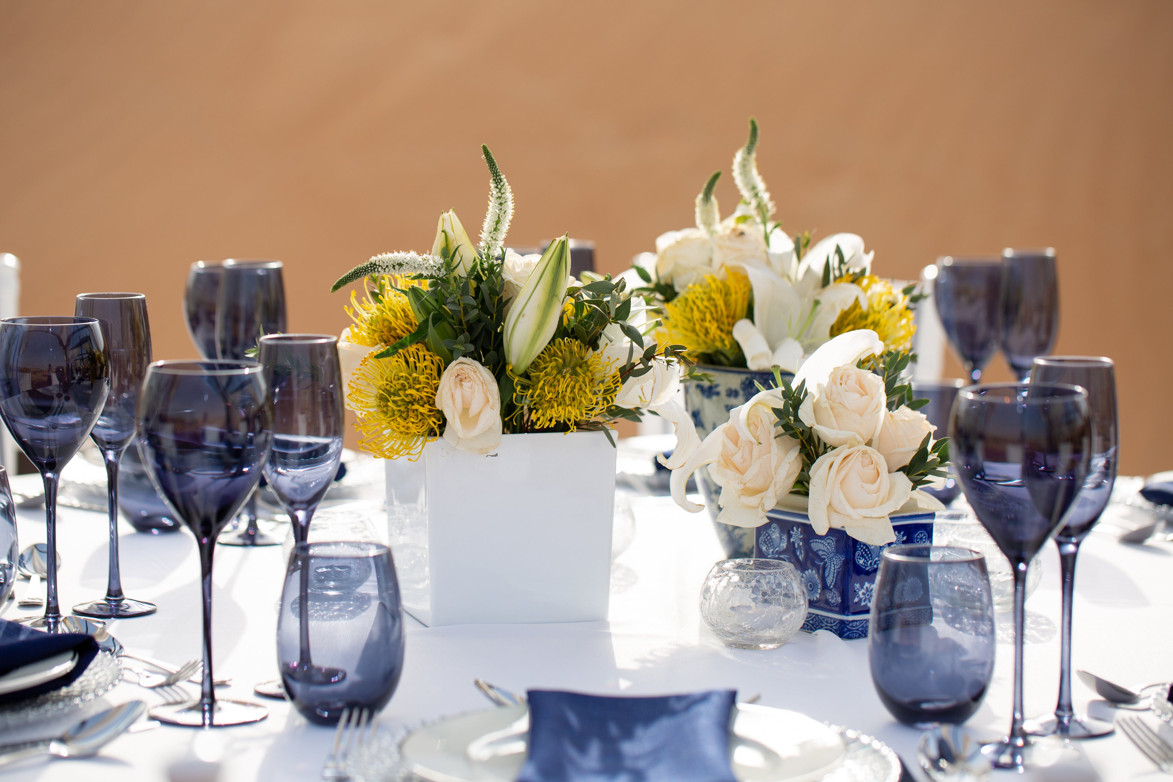 Midnight blue glasses with a deep, rich hue, offering a sophisticated and elegant touch to any table setting.