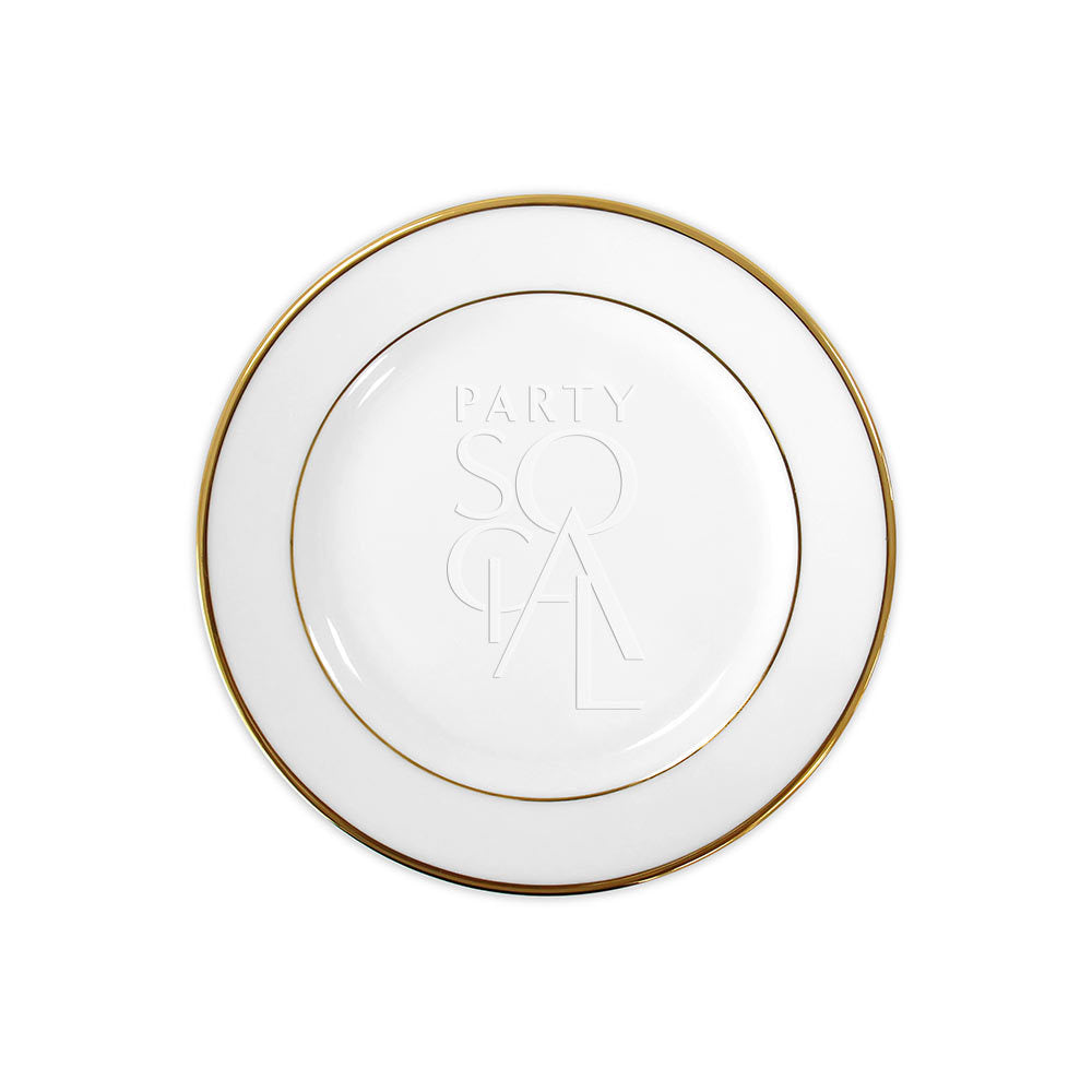 Modern china plate with a refined gold rim, featuring a sleek and contemporary design that adds an elegant touch to any dining occasion.