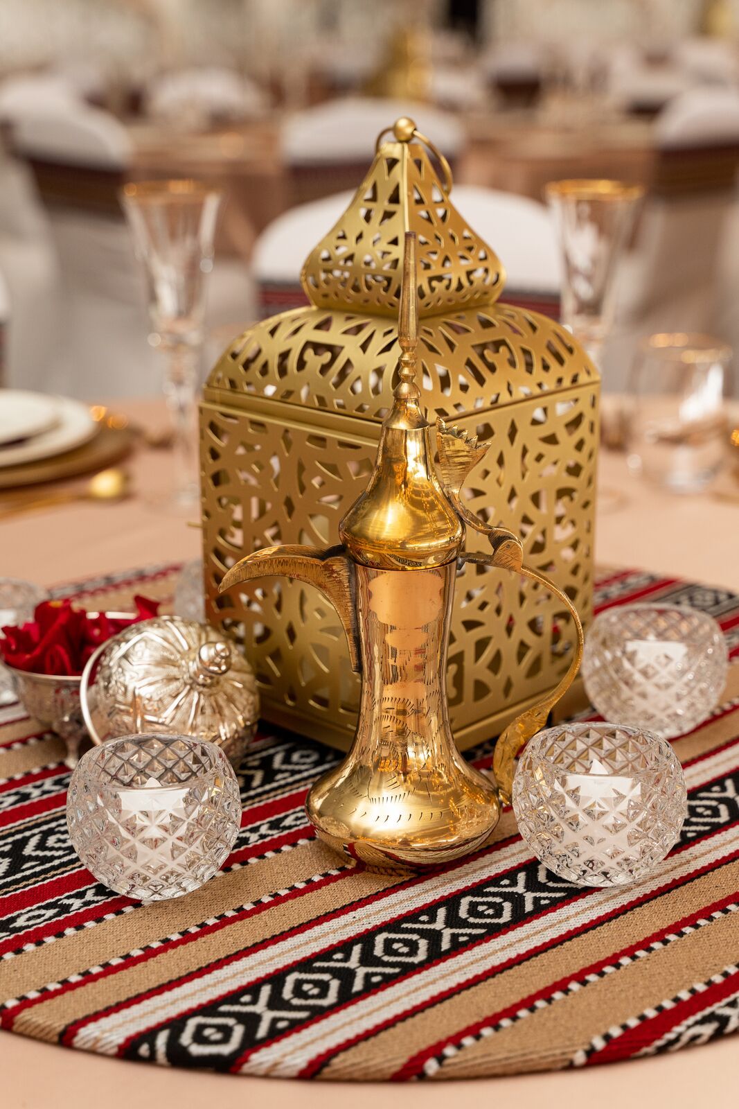 Ornate gold Arabic lanterns featuring intricate geometric patterns and a warm, metallic finish. The lanterns exude a rich, traditional charm, making them ideal for adding a touch of elegance and cultural sophistication to any decor.