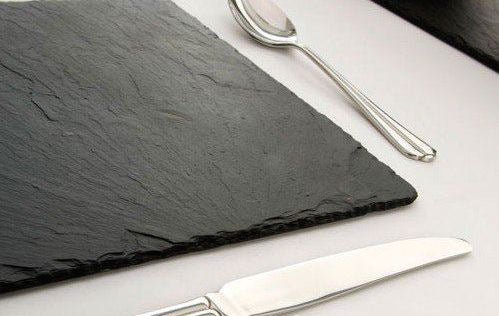 Stylish charger plate in a sleek grey slate finish, ideal for a contemporary and refined table setting.