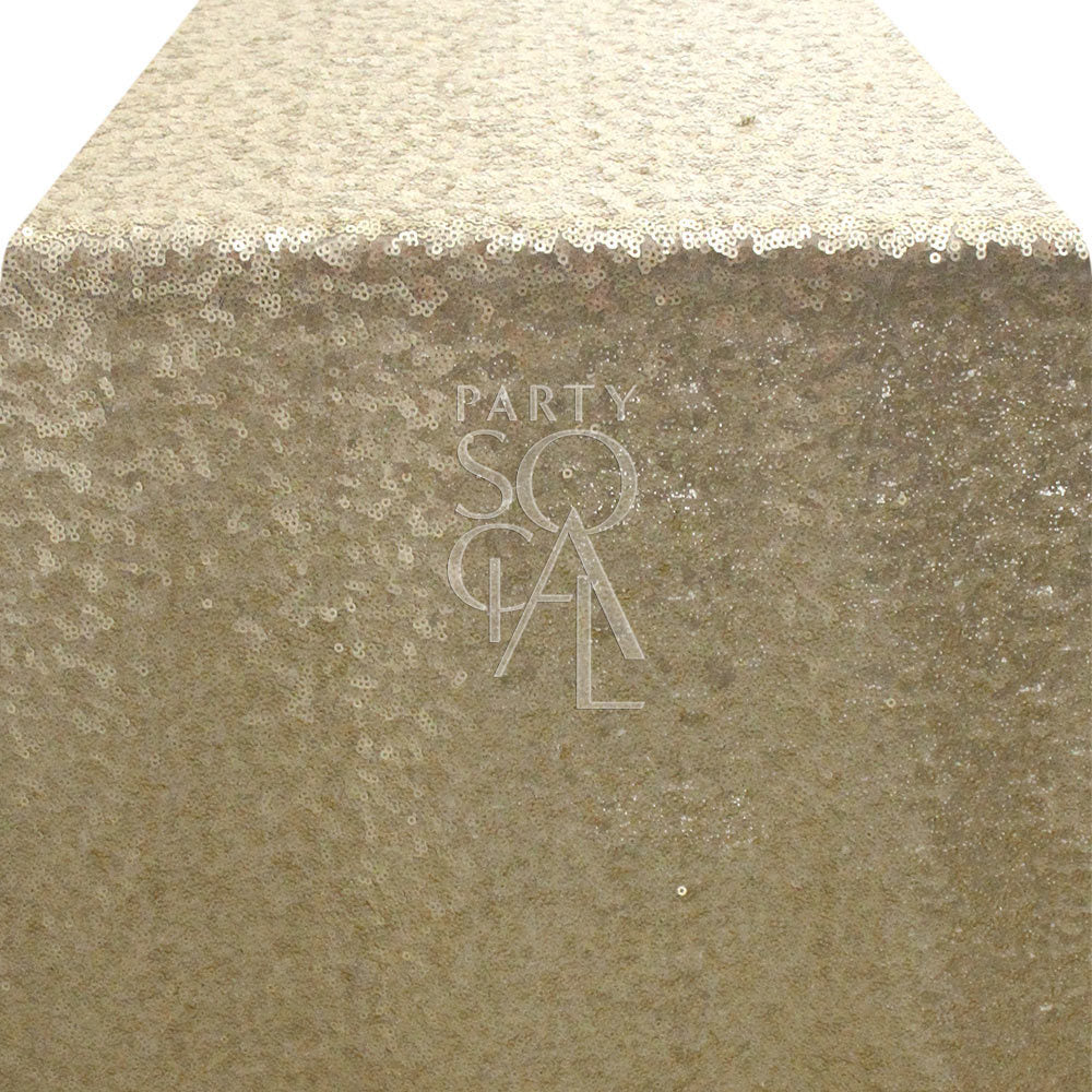 Stylish sequin table runner in a soft light champagne color, featuring a subtle, sparkling texture. The light champagne sequins offer a refined and elegant appearance, perfect for adding a touch of grace and shimmer to any dining table or event.
