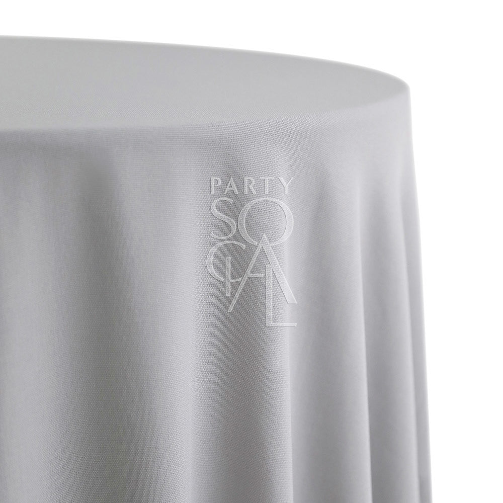 Round cotton linen tablecloth in light grey, offering a soft and neutral tone. The light grey color adds a calm and sophisticated touch, perfect for a modern or minimalist table setting.