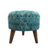 Compact low stool with a minimalist design, featuring a sturdy wooden frame and a cushioned seat covered in a durable fabric. The stool’s low height makes it ideal for casual seating or as a footrest in modern interiors. Its simple, elegant appearance complements various decor styles.
