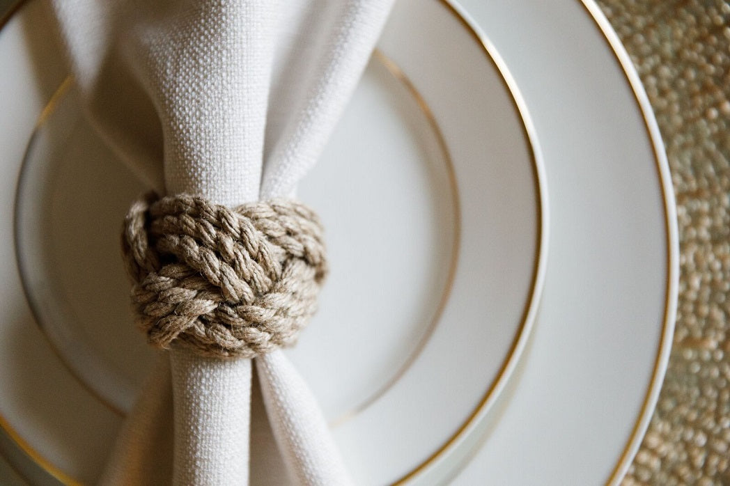 Rustic corded jute round napkin ring, featuring a natural, textured design with a sturdy, woven finish. The round shape and jute material add an earthy, handcrafted touch, perfect for enhancing casual or rustic table settings.