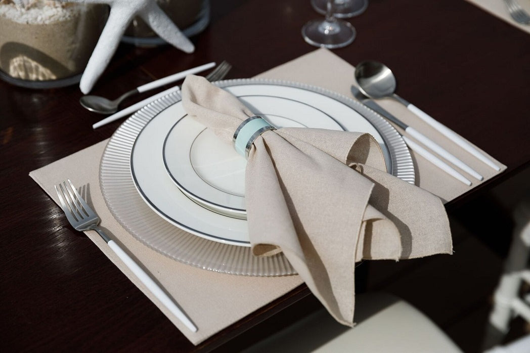 Elegant round napkin ring in silver and aqua, featuring a sleek silver finish with a striking aqua accent. The combination of colors and the polished design add a sophisticated and modern touch to any table setting.