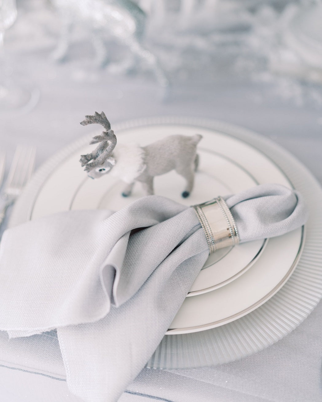 Silver beaded oval napkin ring, featuring an elegant design with shimmering beads arranged in an oval shape, perfect for enhancing table settings.