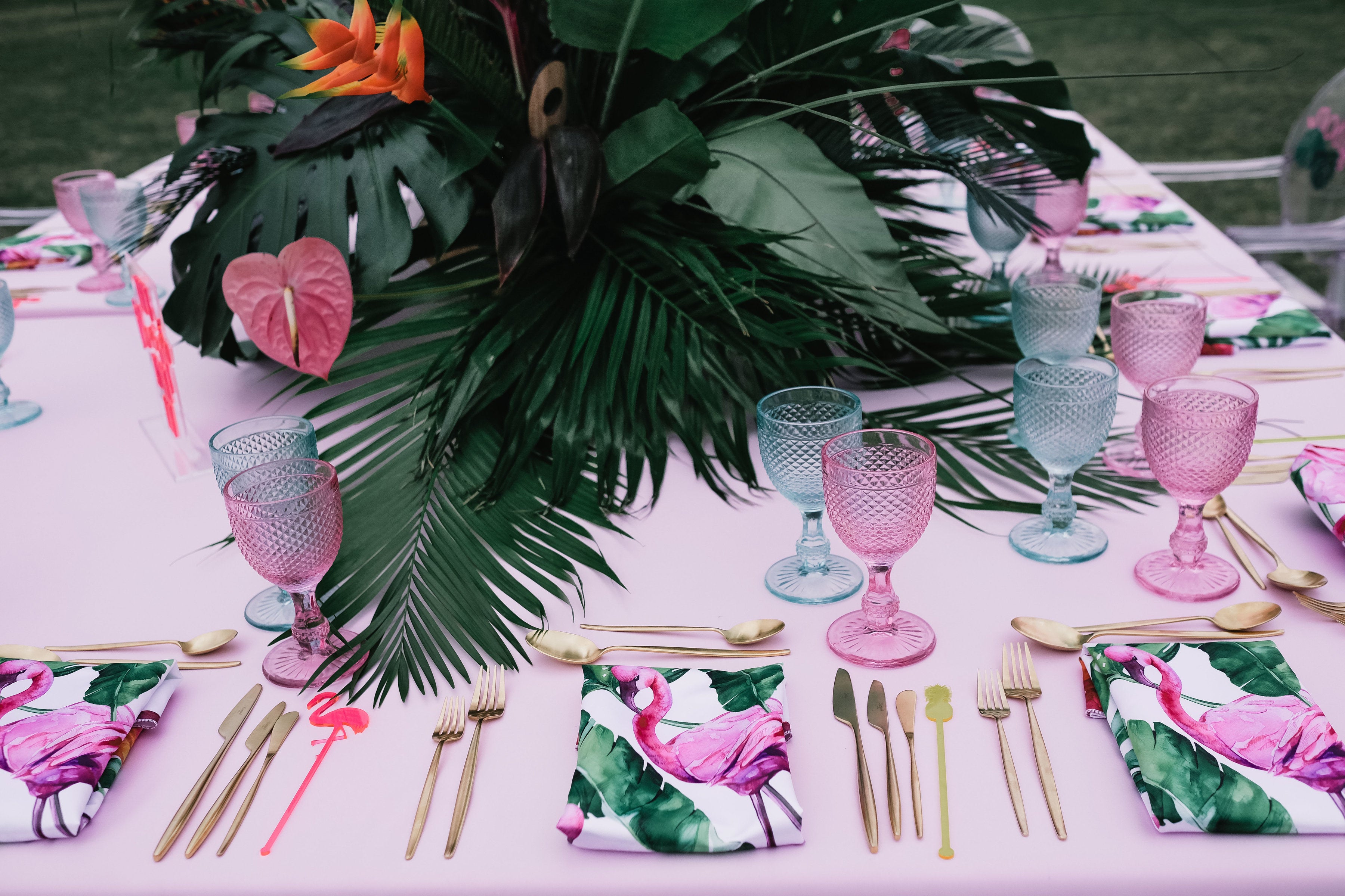 Elegant napkin made from luxurious satin fabric with a playful flamingo print. The napkin features vibrant, detailed illustrations of flamingos against a soft, satin background, adding a touch of tropical charm and sophistication to any dining setting or event.