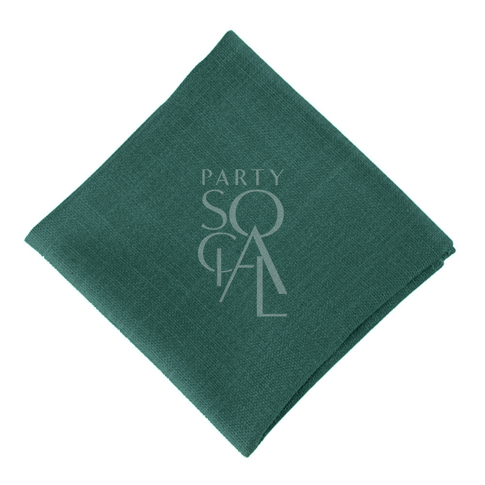 Regal cotton linen napkin in a deep royal green color, featuring a luxurious and smooth texture. The rich green hue adds a touch of elegance and sophistication to any table setting.