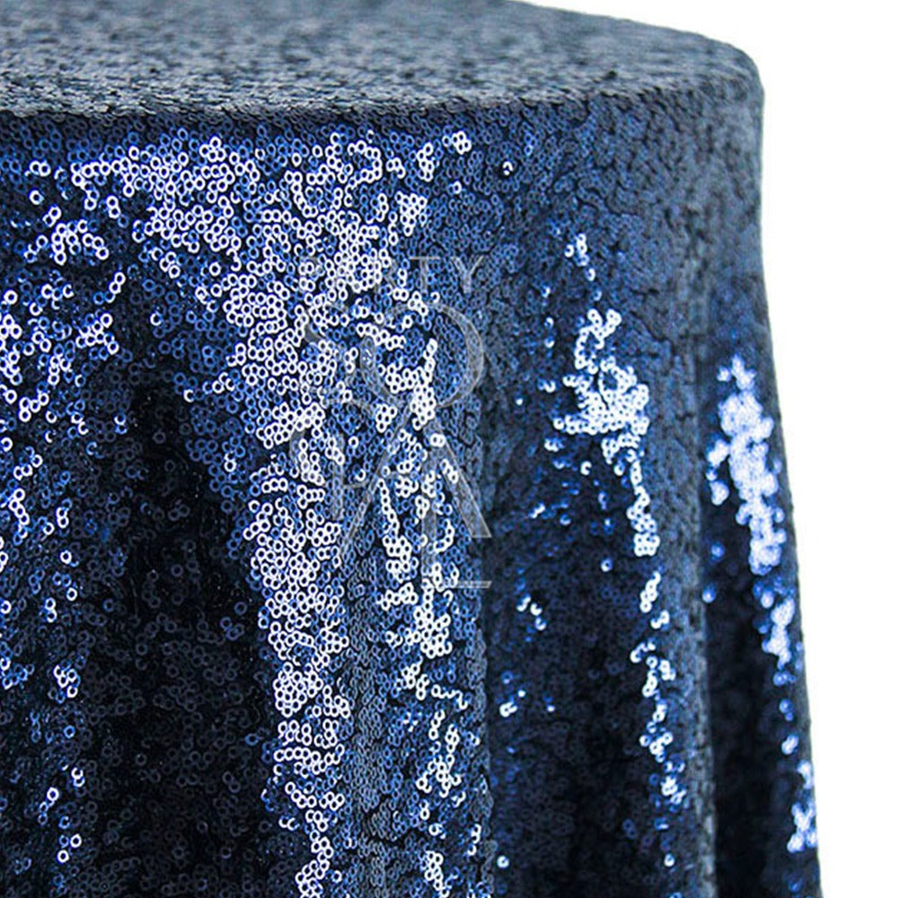 Round sequin tablecloth in deep navy, featuring a luxurious, shimmering surface. The navy sequins add a touch of elegance and sophistication, perfect for creating a dramatic and refined table setting.