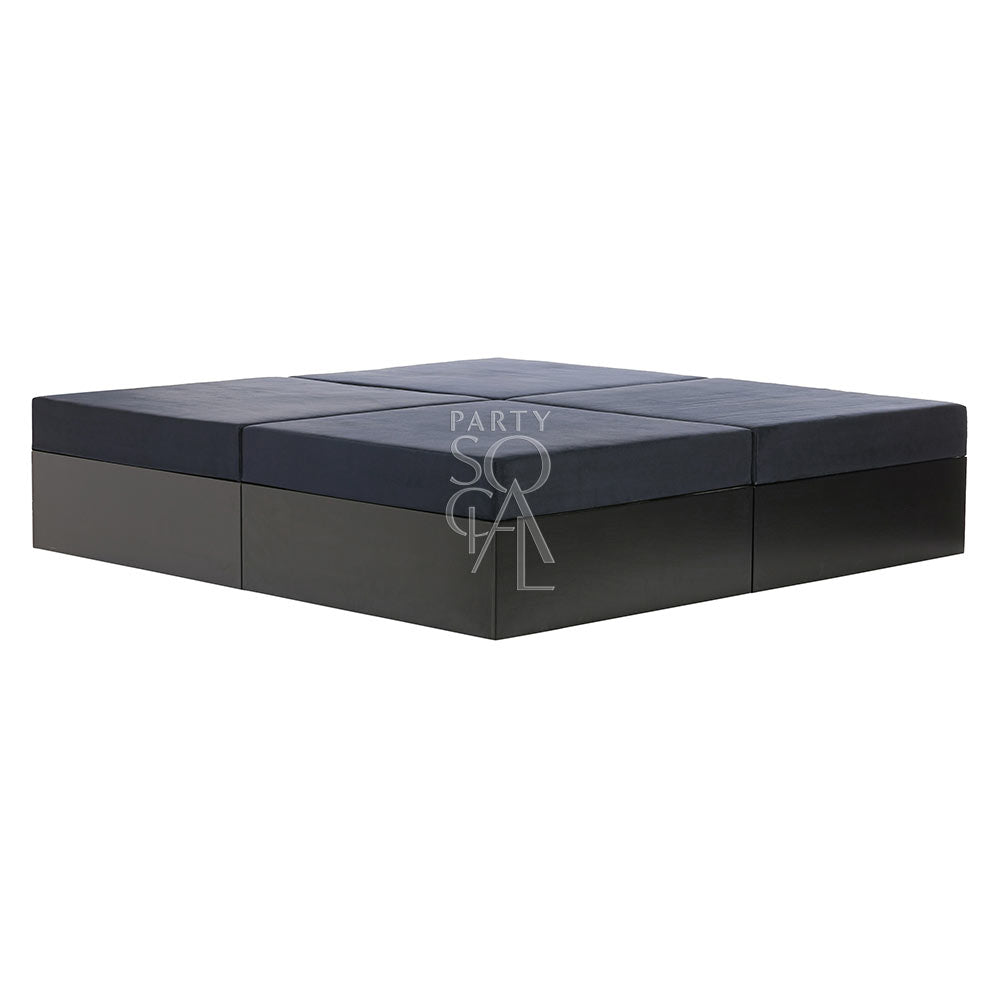 Modern dark grey sofa island with a sleek design, offering a spacious and comfortable seating option, perfect for contemporary living spaces or outdoor lounges.