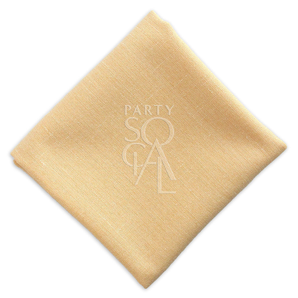 Soft peach linen blend napkin, offering a delicate and warm hue that brings a touch of charm to any table setting.