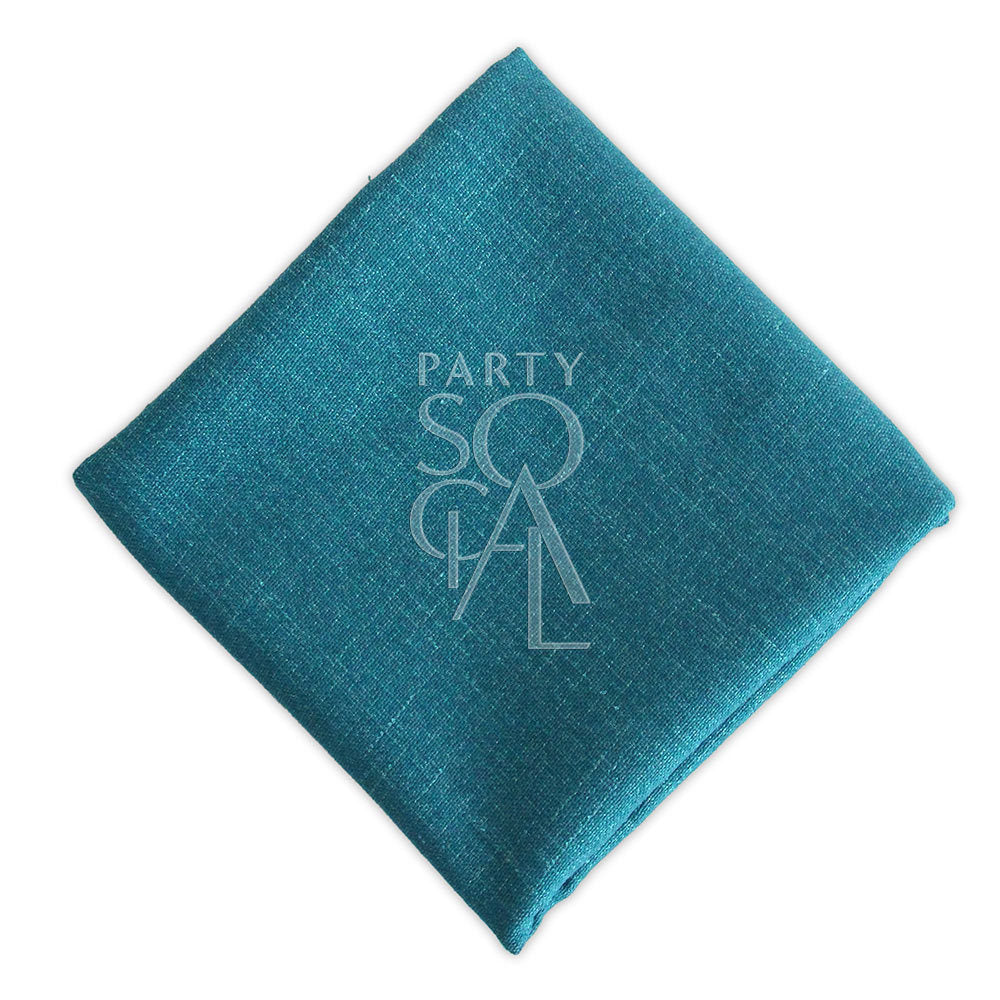 Striking peacock blue linen blend napkin, featuring a bold and vibrant color that adds a touch of luxury and style.