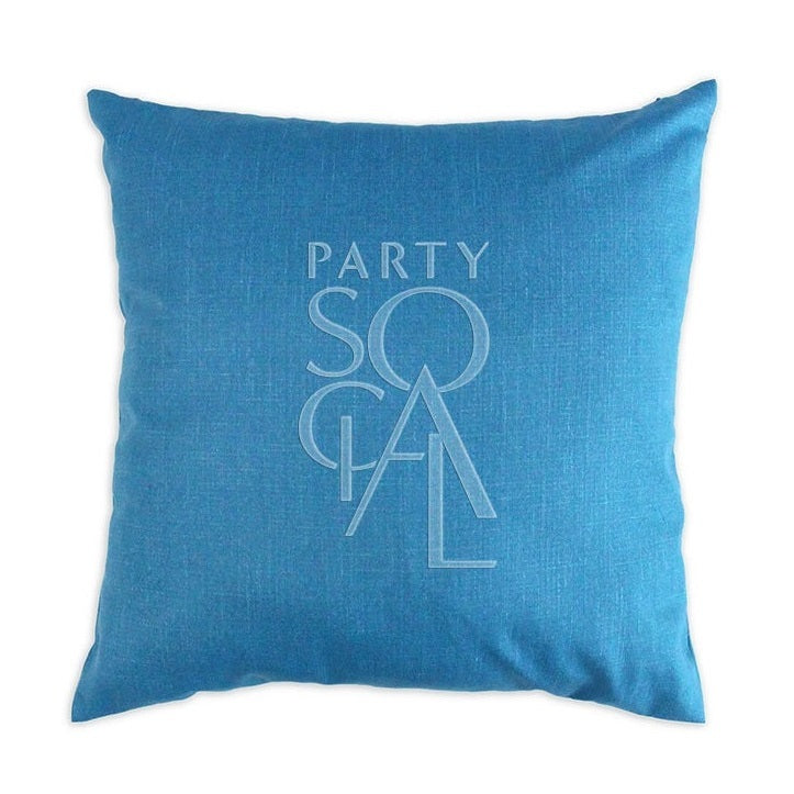 Luxurious linen blend cushion cover in peacock blue, measuring 60x60cm. The striking blue-green color and textured fabric create a bold and elegant statement for larger cushions or decor.