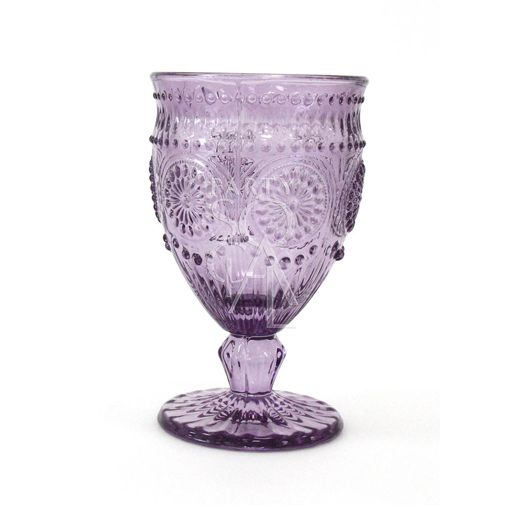 Vintage floral goblet in purple glass, featuring a deep and vibrant hue with intricate floral patterns. The purple glass adds a regal and charming touch, perfect for enhancing elegant and festive occasions.
