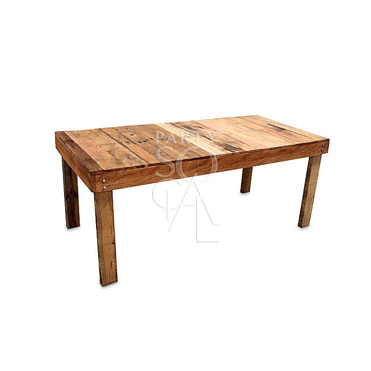 Recycled wooden dining table with a distressed finish, showcasing natural imperfections and a unique, eco-friendly charm. Perfect for a rustic or farmhouse-style dining area.