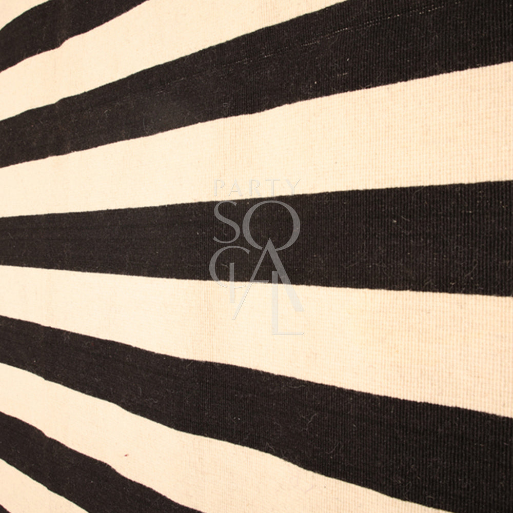 Chic rug with a classic black and white striped pattern, featuring alternating bold stripes that create a striking contrast. The rug’s clean, geometric design adds a modern and stylish touch to any room, enhancing both contemporary and minimalist decor themes.
