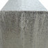 Glamorous sequin table runner in a shimmering silver color, featuring a sparkling surface that catches the light beautifully. The silver sequins add a touch of modern elegance and sparkle, perfect for enhancing any dining table or special event decor.