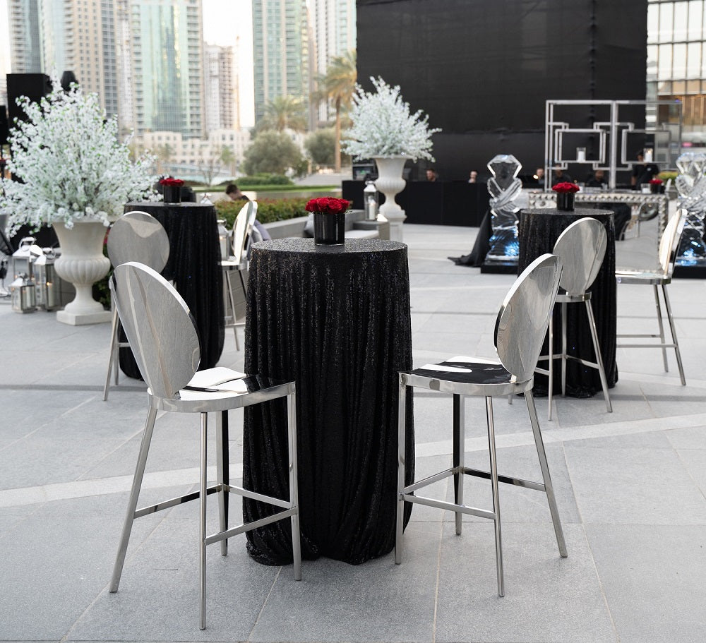 Bar stool with mirrored silver design, elegant event seating, chic silver bar chair, reflective surface stool, stylish party furniture, sophisticated bar stool for events, modern mirrored bar chair.