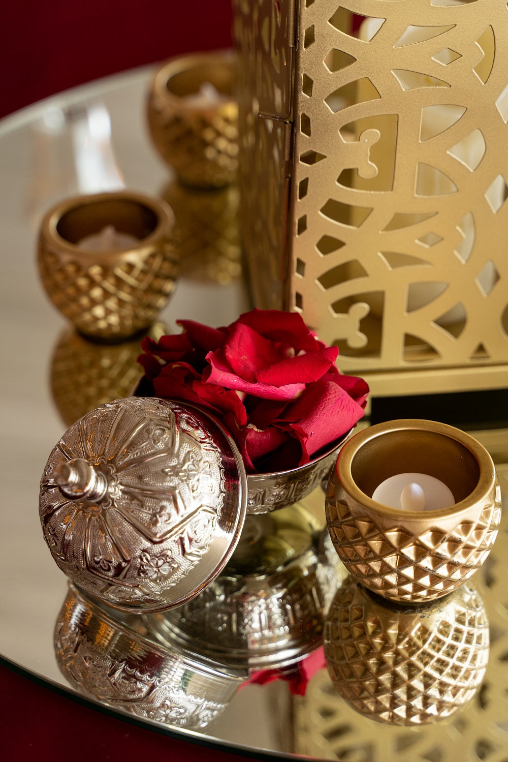 Tea light candle holders in various designs and materials, perfect for adding a warm and inviting glow to any setting.