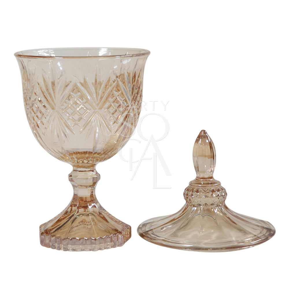 A stunning crystal vase in an amber hue, characterized by its faceted surface that creates a beautiful play of light. The vase features a classic, tapered design with a wide mouth and a slender neck, perfect for showcasing fresh flowers or as a standalone decorative piece.