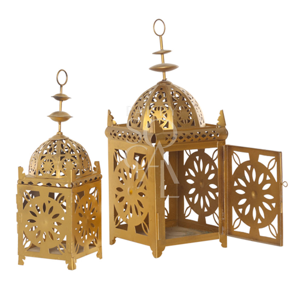 An intricately designed vintage Arabic lantern with a rich gold finish. The lantern features ornate geometric patterns and detailed metalwork, creating a warm, ambient glow when lit. Its classic design includes a hinged door for easy access to the candle or light source inside.